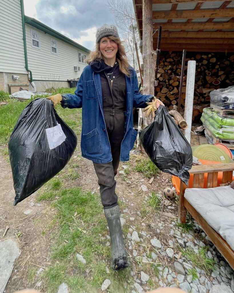Topsy’s resident predation management expert, Rachel Hawkshaw, carries two bags of human hair donated by a local hairdresser.