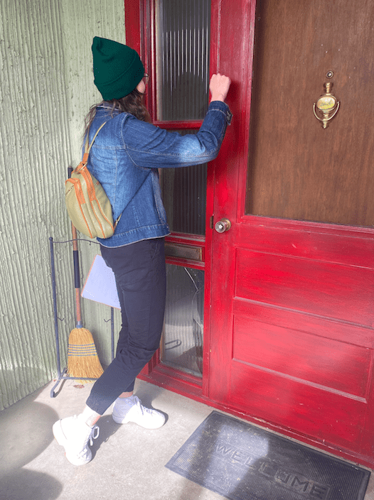 Jessica, a volunteer, knocks on doors in Cranbrook, B.C. —Photo courtesy of Neighbours United